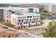Modern townhome exteriors with brick accents, private balconies and drive under garages at 7230 Summit Pl, Alpharetta, GA 30009