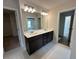 Bright bathroom featuring a double vanity with framed mirror, providing plenty of space and storage at 255 Depot Landing Rd # 38, Auburn, GA 30011