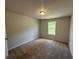 Bedroom showcases neutral colors, a large window and a cozy atmosphere for a tranquil retreat at 255 Depot Landing Rd # 38, Auburn, GA 30011