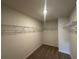Walk-in closet provides ample storage with wire shelving and neutral walls for easy organization at 255 Depot Landing Rd # 38, Auburn, GA 30011