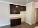 Kitchen featuring dark wood cabinets, granite countertops, and stainless steel appliances at 255 Depot Landing Rd # 38, Auburn, GA 30011