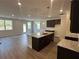 Spacious kitchen featuring an island, granite countertops, and stainless steel appliances at 255 Depot Landing Rd # 38, Auburn, GA 30011