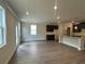 Bright living room with hardwood flooring, connecting seamlessly to the kitchen at 255 Depot Landing Rd # 38, Auburn, GA 30011