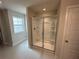 Modern bathroom boasts a spacious walk-in shower with a clear glass enclosure and tile surround at 255 Depot Landing Rd # 38, Auburn, GA 30011