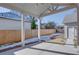 Spacious backyard with covered patio, fenced perimeter, and landscaped area at 3395 Lee St, East Point, GA 30344