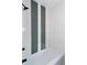 Modern bathroom with white tile and black fixtures at 3395 Lee St, East Point, GA 30344