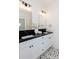 Bathroom featuring a large double vanity with striking black countertops at 3395 Lee St, East Point, GA 30344