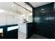 Stunning bathroom featuring emerald tile in the shower with a glass enclosure at 3395 Lee St, East Point, GA 30344