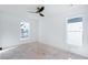 Bright, airy bedroom with large windows and a modern ceiling fan at 3395 Lee St, East Point, GA 30344
