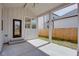 Covered patio with modern lighting, a back door, and partial fenced yard at 3395 Lee St, East Point, GA 30344