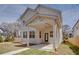 Charming two-story home with large covered patio and landscaped yard at 3395 Lee St, East Point, GA 30344