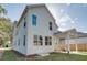 Two story home with a covered patio area and fenced yard at 3395 Lee St, East Point, GA 30344