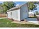 A new white garage with a side door and an automatic overhead door at 3395 Lee St, East Point, GA 30344
