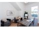Well-lit home office with modern desk, gray chairs, and minimalist decor creating a productive workspace at 3395 Lee St, East Point, GA 30344