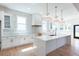 Spacious white kitchen featuring stainless steel appliances and a large center island at 3395 Lee St, East Point, GA 30344