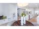 Bright kitchen eating area with seating, decorative vases on a round table, and white accent walls at 3395 Lee St, East Point, GA 30344