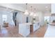 Bright, open kitchen featuring a large island with white countertops and modern pendant lighting at 3395 Lee St, East Point, GA 30344