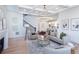 Bright living room showcasing coffered ceiling, hardwood floors, neutral tones, and an elegant modern chandelier at 3395 Lee St, East Point, GA 30344