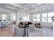 Bright living room with coffered ceilings and an open concept kitchen with modern decor and natural light at 3395 Lee St, East Point, GA 30344