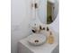 Stylish powder room featuring a seashell sink, marble countertop, and gold fixtures at 3395 Lee St, East Point, GA 30344