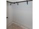 Walk-in closet with black metal rack and black fittings at 3395 Lee St, East Point, GA 30344