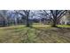 Large, grassy backyard with mature trees, offering plenty of space and natural shade at 75 Doves Nest, Covington, GA 30016