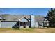 Expansive backyard view featuring a trampoline and exterior of the house, perfect for outdoor activities at 75 Doves Nest, Covington, GA 30016