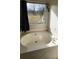 Bathroom featuring a large bathtub and a window providing natural light and a view of the outdoors at 75 Doves Nest, Covington, GA 30016