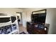 Bedroom with bunk bed, dresser, and doorway leading to another room at 75 Doves Nest, Covington, GA 30016