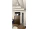 Bedroom featuring decorative tray ceiling, television and attached bathroom at 75 Doves Nest, Covington, GA 30016
