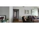 Comfortable living room showcasing neutral walls, carpet, and a recliner facing forward at 75 Doves Nest, Covington, GA 30016