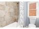 Cozy bathroom with shower over tub and decorative tile at 232 Hunt Ne St, Marietta, GA 30060