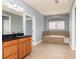 Bathroom featuring a soaking tub and tile flooring at 232 Hunt Ne St, Marietta, GA 30060