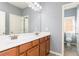 Bathroom features double sinks, tile floors, and neutral paint at 232 Hunt Ne St, Marietta, GA 30060
