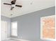 Bedroom featuring two windows, neutral paint, and ceiling fan at 232 Hunt Ne St, Marietta, GA 30060