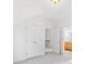Clean bedroom with neutral carpet, features an adjacent door to a bathroom and closet, creating a welcome retreat at 232 Hunt Ne St, Marietta, GA 30060