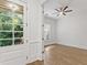 Bright bedroom with hardwood floors, neutral paint, and french door to a balcony at 232 Hunt Ne St, Marietta, GA 30060