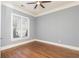 Bright and airy bedroom with hardwood floors and large window at 232 Hunt Ne St, Marietta, GA 30060