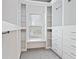 Walk-in closet with custom shelves, drawers, and a window for natural light at 232 Hunt Ne St, Marietta, GA 30060