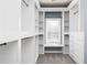 Bright walk-in closet with custom shelving, storage, and natural light from a window at 232 Hunt Ne St, Marietta, GA 30060