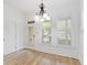 Dining area featuring hardwood floors, a modern light fixture, and a door leading to the outside at 232 Hunt Ne St, Marietta, GA 30060