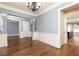 Open-concept dining room with hardwood floors and adjacent kitchen view at 232 Hunt Ne St, Marietta, GA 30060