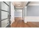 Elegant foyer with hardwood floors, wainscoting, and neutral paint at 232 Hunt Ne St, Marietta, GA 30060