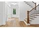Inviting foyer with hardwood floors, elegant staircase, and natural light at 232 Hunt Ne St, Marietta, GA 30060