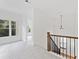 Bright hallway with natural light features neutral carpet and trim, creating a welcoming and airy atmosphere in the home at 232 Hunt Ne St, Marietta, GA 30060