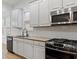 Modern kitchen with stainless steel appliances, granite countertops, and subway tile backsplash at 232 Hunt Ne St, Marietta, GA 30060
