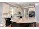Bright kitchen boasts granite countertops, stainless steel appliances, and custom cabinetry at 232 Hunt Ne St, Marietta, GA 30060