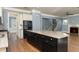 Large kitchen with island, stainless steel appliances, hardwood floors, and open floor plan at 232 Hunt Ne St, Marietta, GA 30060