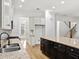 Kitchen featuring granite counters, stainless sink, black fixtures and large contrasting center island with drawers at 232 Hunt Ne St, Marietta, GA 30060