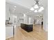 Bright open kitchen flowing into the living area, featuring a large center island and modern lighting at 232 Hunt Ne St, Marietta, GA 30060